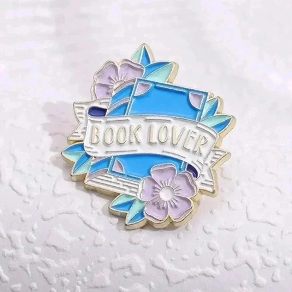 Book lover brooch pin collectible gold and blue floral design nature bag…